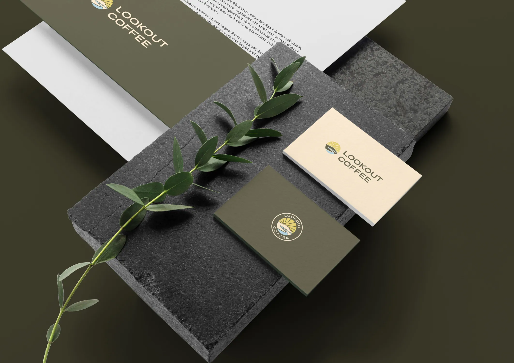 Lookout Coffee brand identity — deep olive and warm yellow palette applied across stationery and packaging